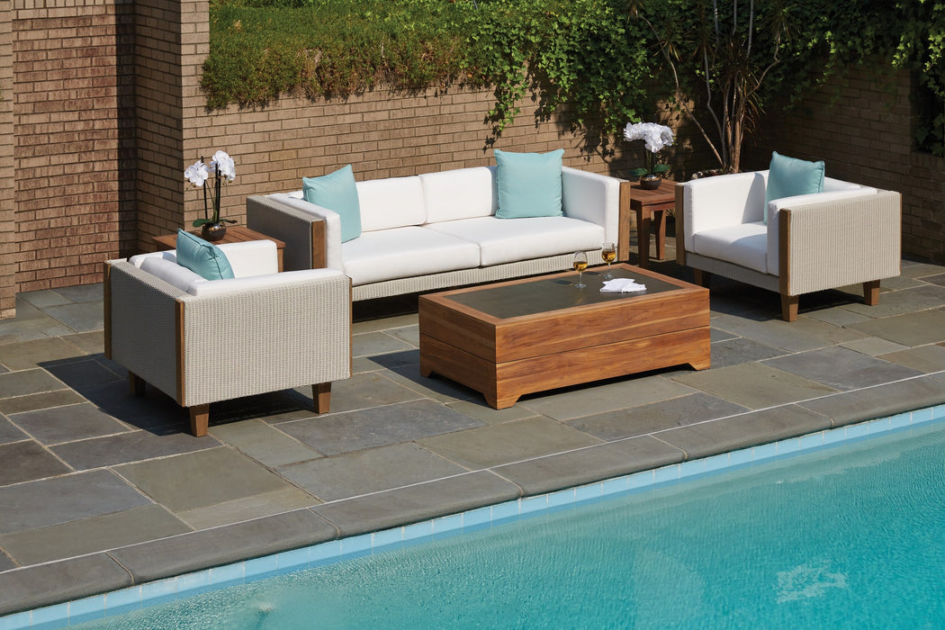 Lloyd Flanders Catalina sofa and lounge chairs in Linen beside a pool