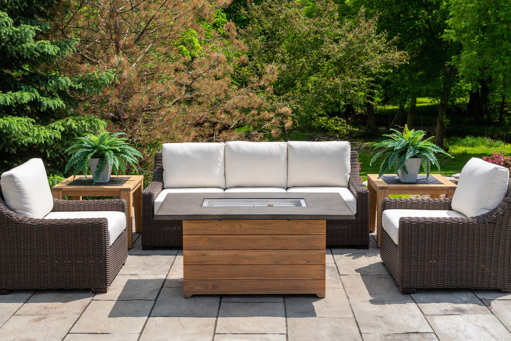 Lloyd Flanders Mesa sofa and lounge chairs around the Teak 52 inch rectangular fire table