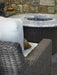 Lloyd Flanders Mesa 48 inch round fire table with granite top, lit