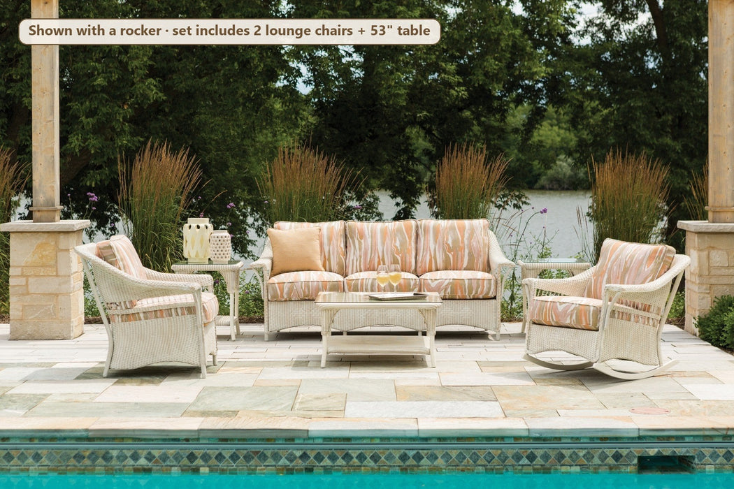 Lloyd Flanders Nantucket 4-piece seating set by a pool (shown with a rocker; set includes 2 lounge chairs)
