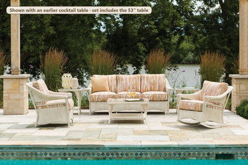 Lloyd Flanders Nantucket 4-piece seating set with lounge rocker by a pool (shown with an earlier cocktail table)