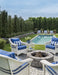 Lloyd Flanders Nantucket lounge chairs in Ivory around a fire pit