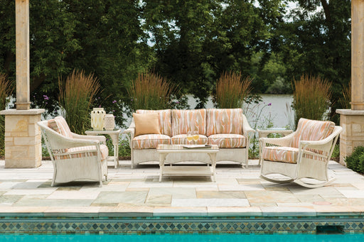Lloyd Flanders Nantucket sofa and lounge chairs in Antique White by a pool