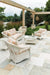 Lloyd Flanders Nantucket seating in Antique White under a pergola