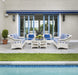Lloyd Flanders Nantucket lounge chairs in Ivory on a poolside patio