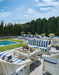 Lloyd Flanders Nantucket sofa and lounge chairs in Ivory by a pool
