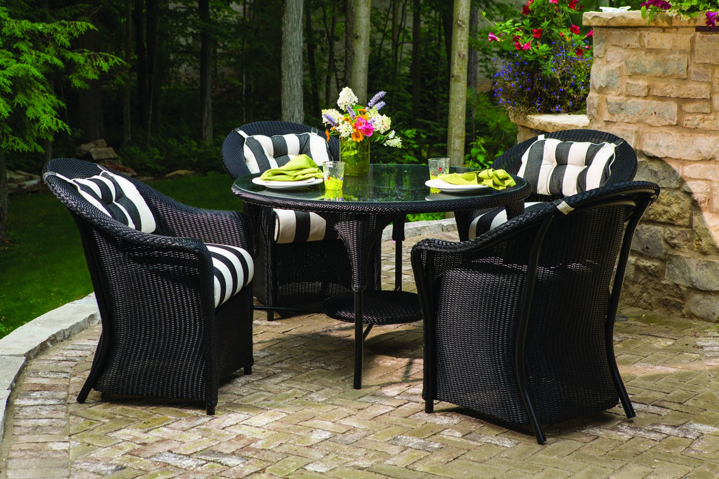 Lloyd Flanders Reflections dining armchairs in Ebony around a round table