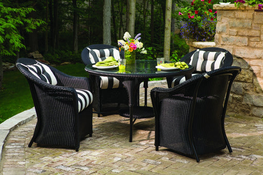 Lloyd Flanders Reflections dining armchairs in Ebony around a round table