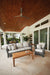 Lloyd Flanders Reflections sofa and lounge chairs in Pewter on a covered patio