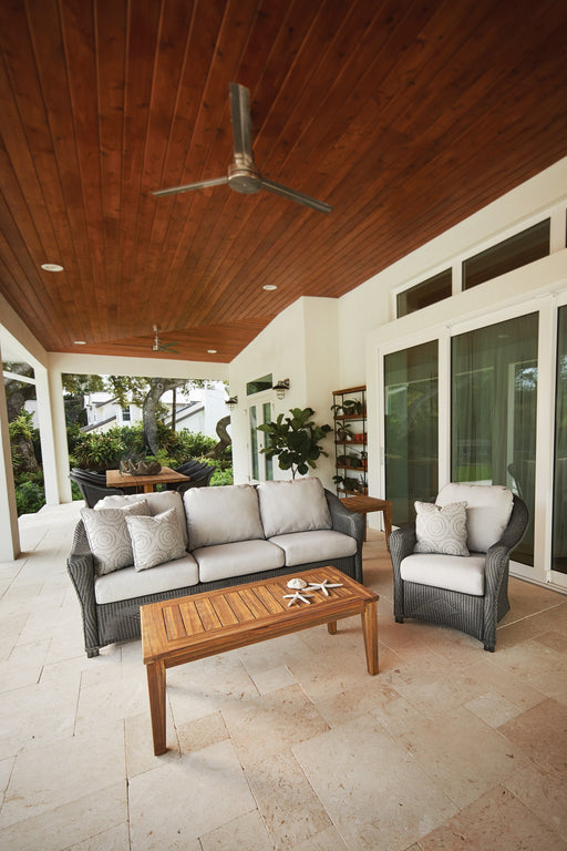 Lloyd Flanders Reflections sofa and lounge chairs in Pewter on a covered patio