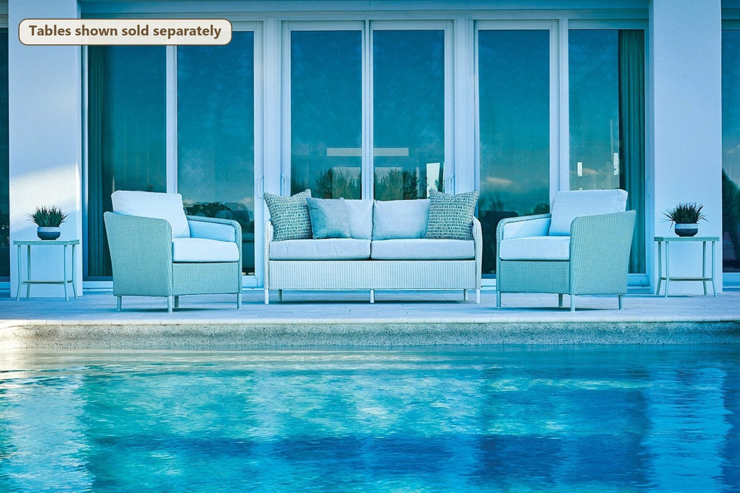 Lloyd Flanders Visions 3-Piece Seating Set on a patio (Tables shown sold separately)
