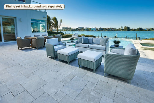 Lloyd Flanders Visions 5-Piece Lounge Set with Ottomans on a patio (Dining set in background sold separately)