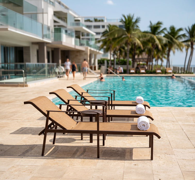 Woodard Louie pieces in an outdoor setting (some pieces shown are sold separately)