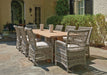 Lloyd Flanders Mackinac dining chairs around a teak table