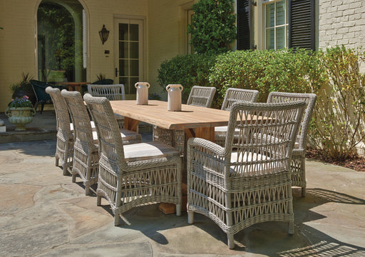 Lloyd Flanders Mackinac dining chairs around a teak table