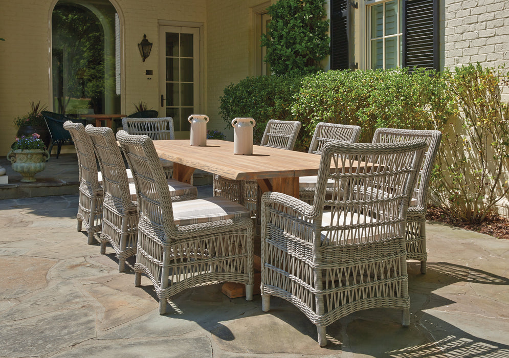 Lloyd Flanders Mackinac dining chairs around a teak table