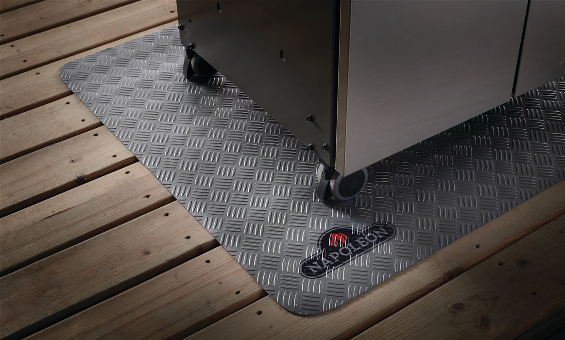Napoleon grill mat under a grill on a wood deck