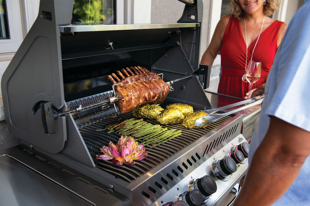 Napoleon Prestige 500 with rack of pork on the rotisserie over stainless Wave cooking grids