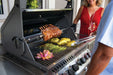 Napoleon Prestige 500 with rack of pork on the rotisserie over stainless Wave cooking grids
