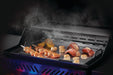 Napoleon stainless steel griddle insert with shrimp, scallops and vegetables cooking