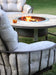 OW Lee Compass fire pit surround with a Breeo X24 Corten smokeless fire pit burning inside