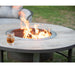 OW Lee Compass wood-burning fire table with a Breeo X24 Corten fire pit burning