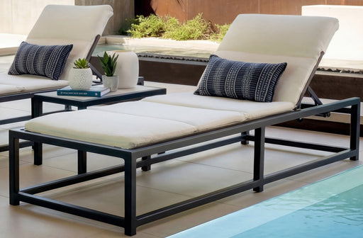 OW Lee #290 chaise cushion laid over a sling chaise by the pool (shown on the OW Lee Tetra chaise)