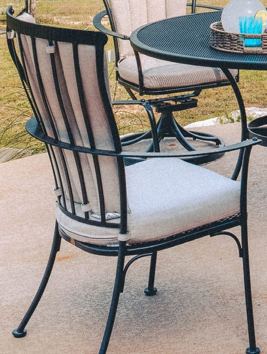 OW Lee Monterra dining arm chair with the optional back cushion tied on