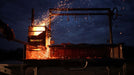 Embers glowing in the Tagwood BBQ03SS firebox at night