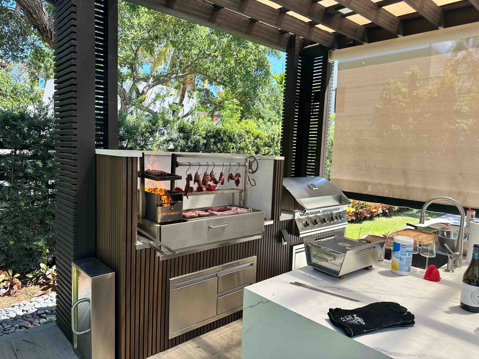 Tagwood BBQ05SS built into an outdoor kitchen with meat on the hooks