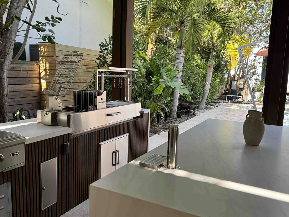 Tagwood BBQ08SS built into a modern outdoor kitchen under the palms