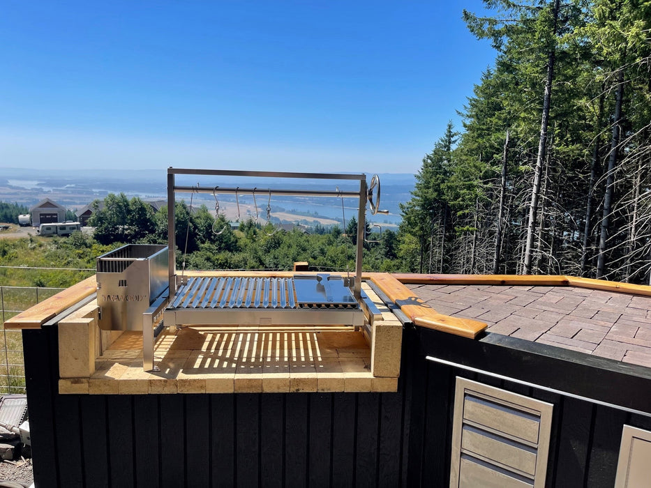 Tagwood BBQ09SS set into an outdoor counter with a mountain view