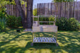 Tagwood BBQ23SS on a lawn by a wood fence