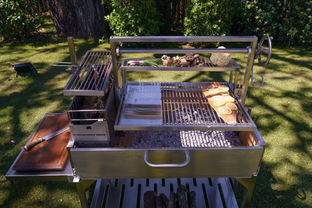 Steaks and chicken on the deep grate of a Tagwood BBQ23SS
