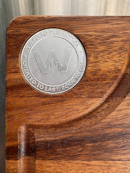 Metal Tagwood logo inlaid in the walnut board