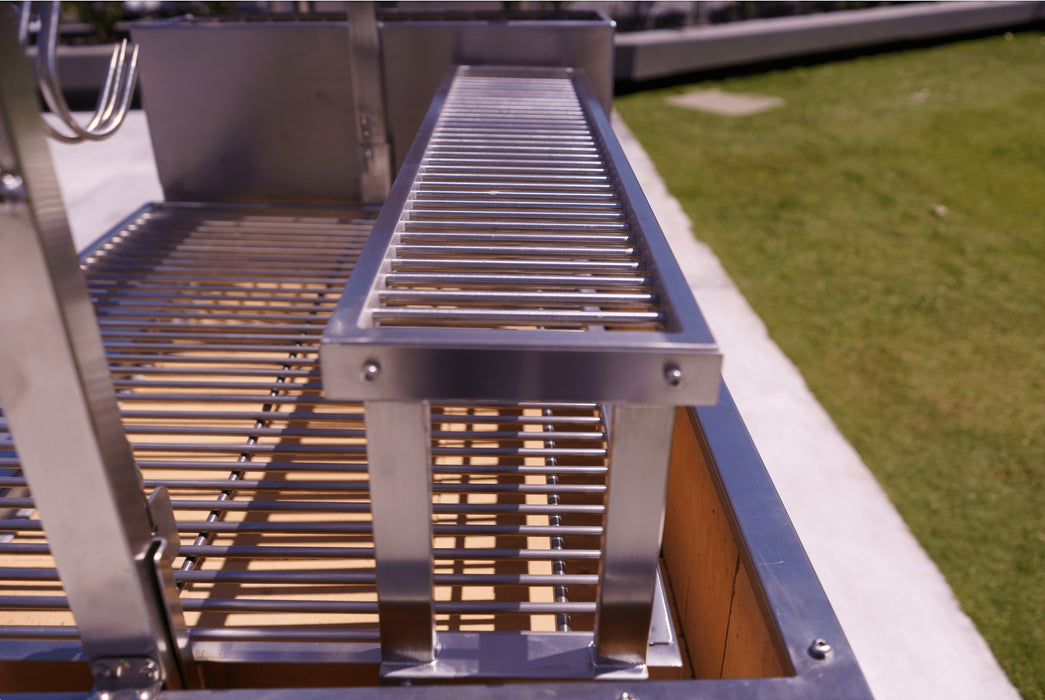 Tagwood warming rack over the main grate
