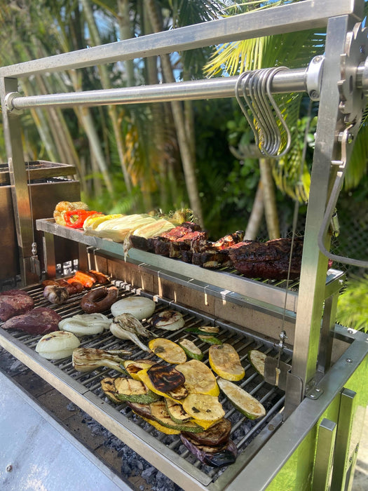 Food warming on the rack above a Tagwood grill