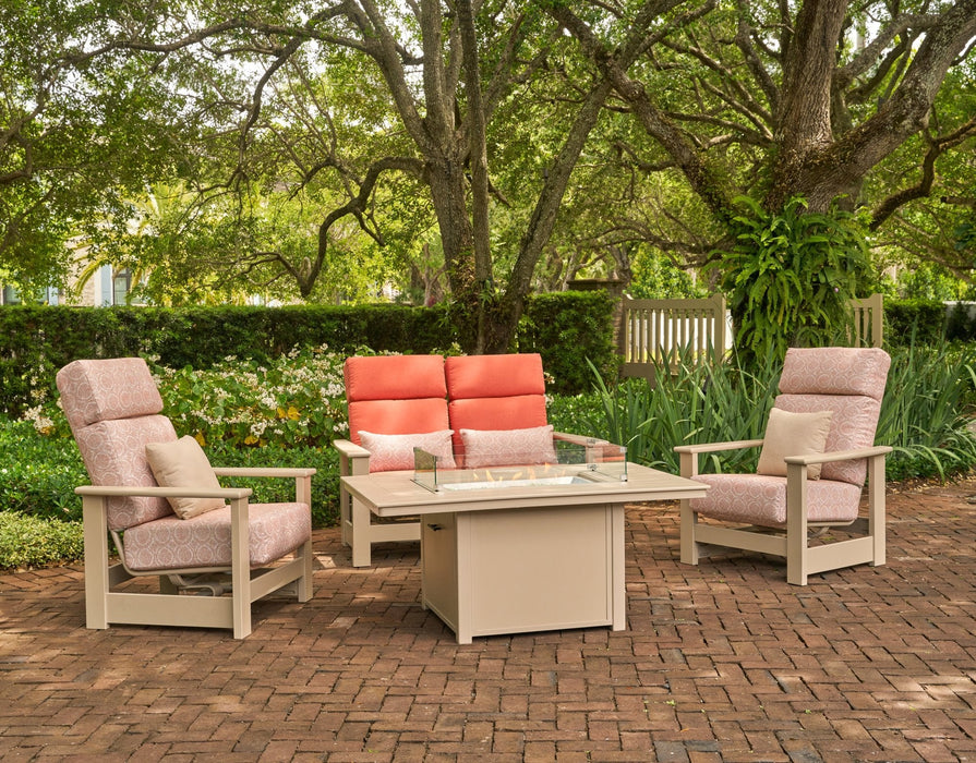 Telescope Casual seating around a 36" x 54" fire table with the glass surround in a garden