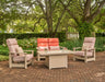 Telescope Casual seating around a 36" x 54" fire table with the glass surround in a garden