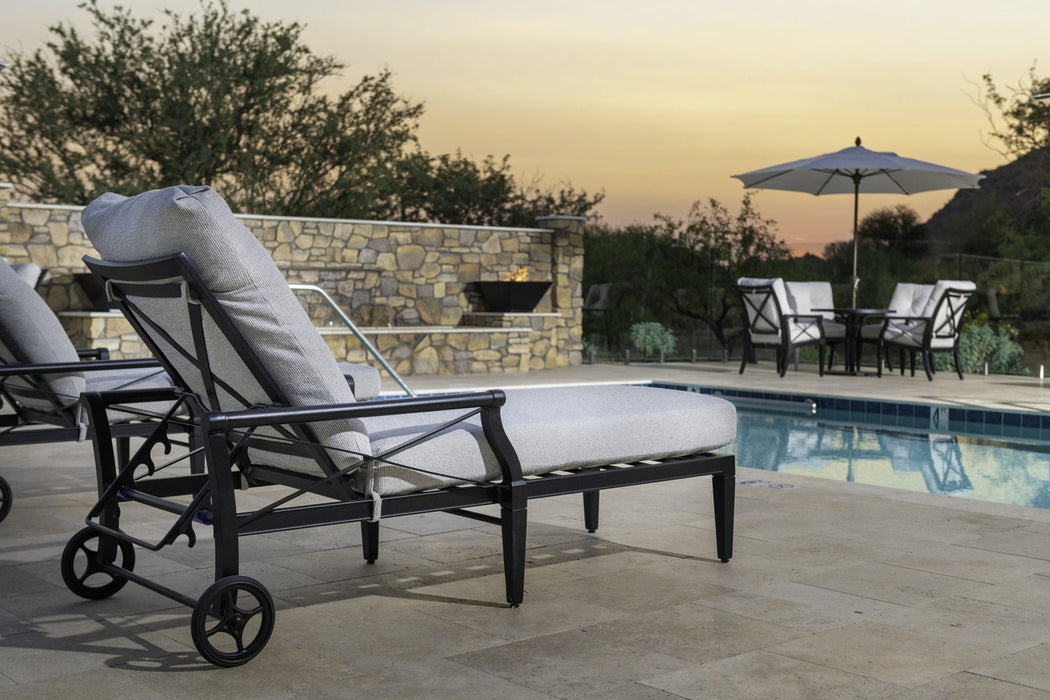 Woodard Andover adjustable chaise lounge with wheels beside a pool