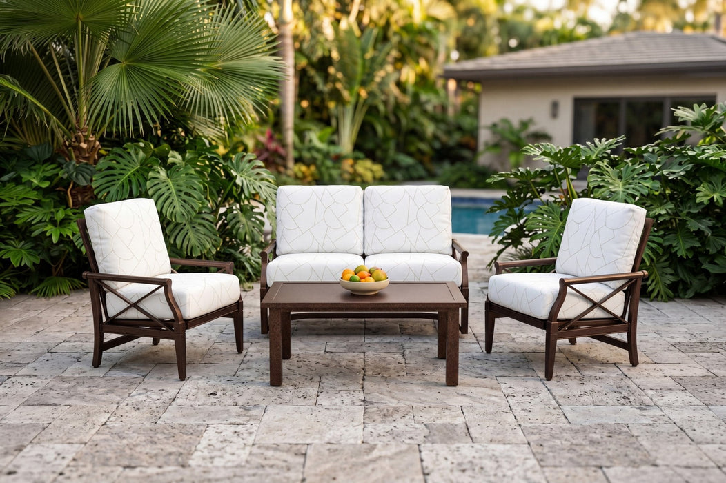Woodard Andover cushion lounge seating on a stone patio