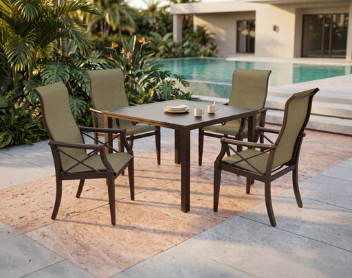 Woodard Andover sling dining arm chairs around a table by a pool (table not included)