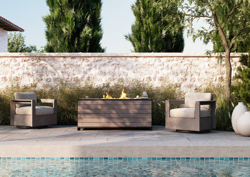Woodard Beau swivel lounge chairs by a fire table (pieces shown sold separately)