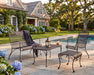 Woodard Briarwood love seat, lounge chair and ottoman on a poolside patio