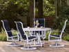 Woodard Cortland Padded Sling High-Back Swivel Rocking Dining Arm Chair in an outdoor setting