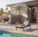 Woodard Daytona sling adjustable chaise lounge by a pool, with a side table and umbrella (sold separately)