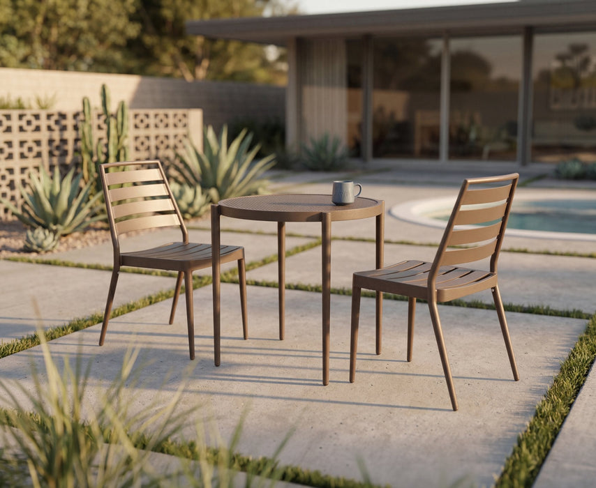 Two Woodard Daytona slat side chairs in a warm wood-tone finish at a small bistro table (table not included)