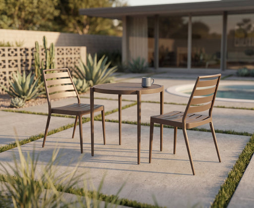 Two Woodard Daytona slat side chairs in a warm wood-tone finish at a small round bistro table (table sold separately)
