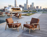 Woodard Elevation lounge chairs on a rooftop deck (trays sold separately)