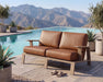 Woodard Elevation love seat by a pool